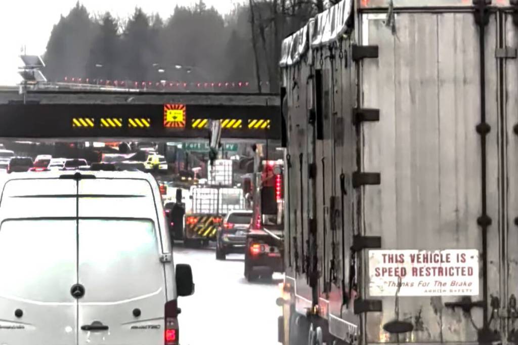 Flatdeck crane strikes Langley’s Highway 1 rail overpass